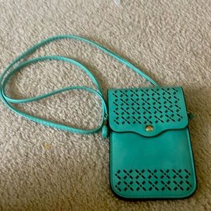 Teal has pocket for money back touchscreen for phone